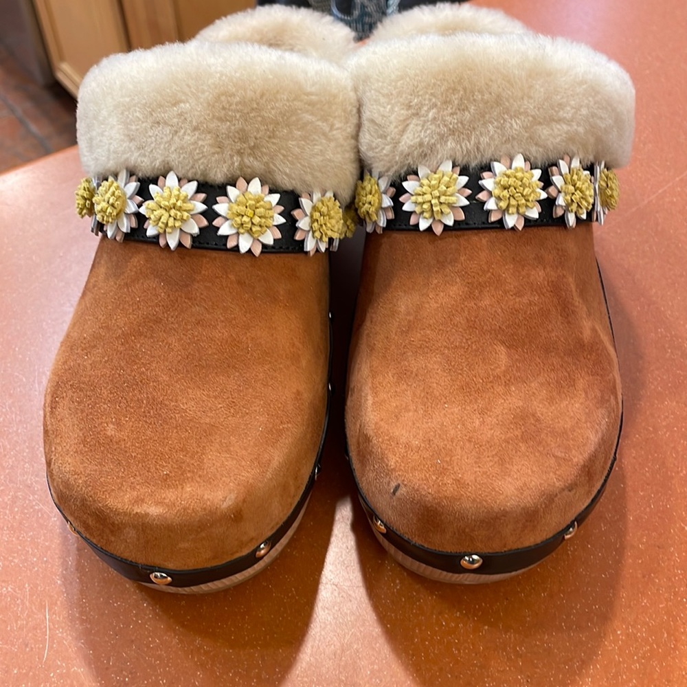 Wood and suede clogs gently worn